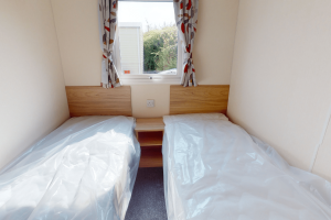 New Europa Caernarfon 28ft x 12ft - 2 bed static caravan for sale at Castel Cove Caravan Park, Abergele North Wales - Twin Bedroom